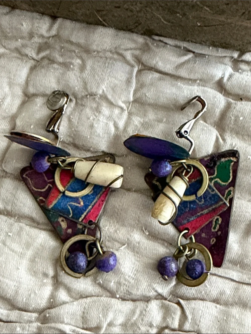 Clip style earrings artist made abstract metal pieces with attached panels